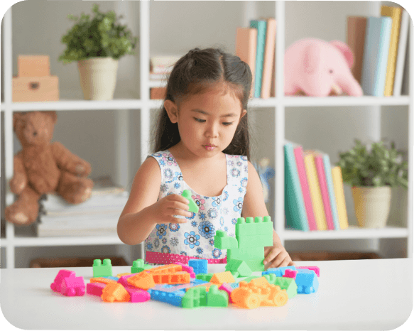 A child engaged in play, exploring their interests